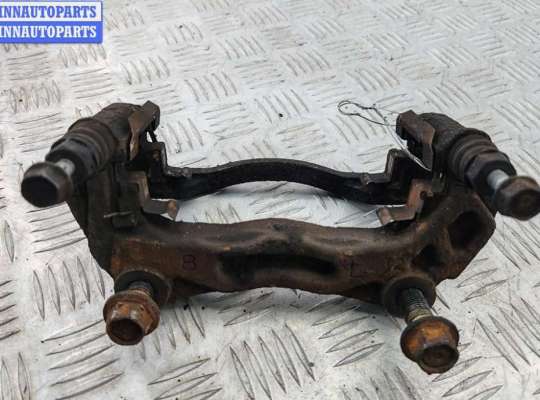 Скоба суппорта переднего NS989174 на Nissan Pathfinder