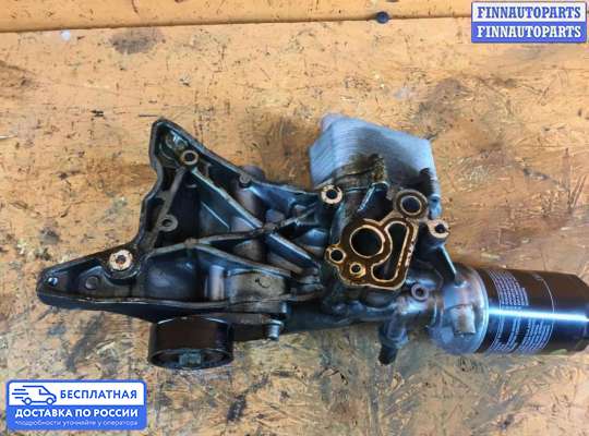 Корпус масляного фильтра на Volkswagen Passat B6 (3C)