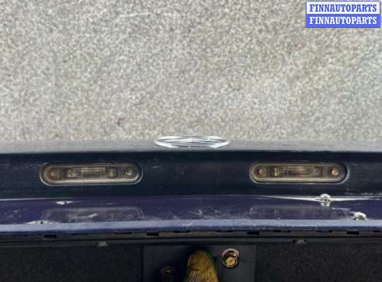 Планка подсветки номера на Mercedes-Benz E (W124)