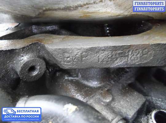 Корпус масляного фильтра на Volkswagen Passat B6 (3C)