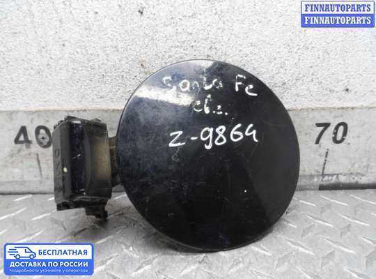 Лючок бензобака на Hyundai Santa Fe II (CM)